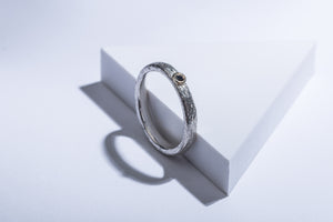 Silver ring with gold details & black brilliant