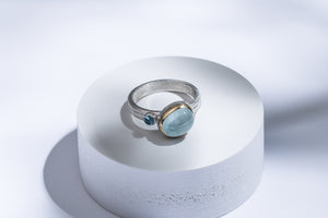 Silver ring with gold details, aquamarine & topaz stones