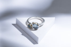 Silver ring with gold details, aquamarine & topaz stones