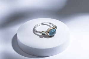 Silver ring with gold details, aquamarine & sapphires