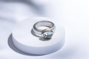 Silver ring with gold details & aquamarine stone