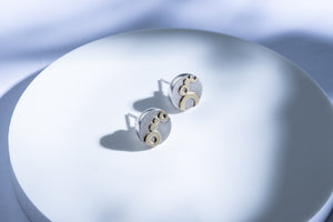 Silver earrings with gold details