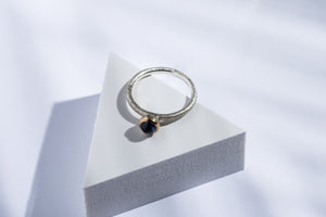 Silver ring with gold details & blue sapphire